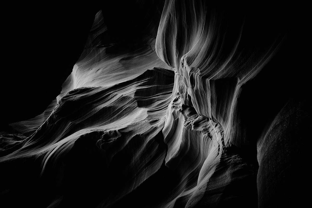 black-and-white grey rock formation smoke